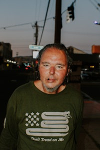 a man wearing a green shirt